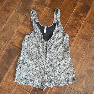 RVCA floral romper with zip front, adjustable straps, 2 front/back pockets